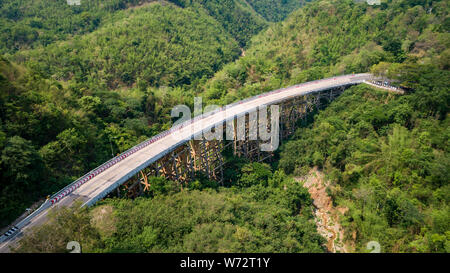 Pho Khun Pha Muang bridge. The high concrete bridge in Phetchabun province, Thailand. Connect northern to northeast. Aerial view from flying drone. Stock Photo