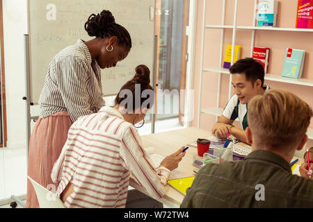 Group of delighted people discussing their exam Stock Photo