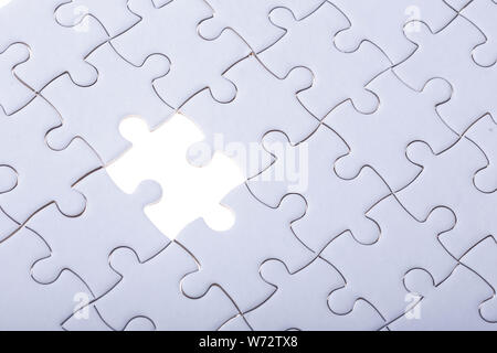 Connection concept : Pattern of jigsaw puzzle and one of missing hole Stock Photo