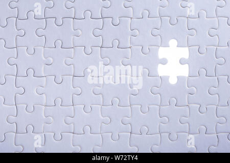 Connection concept : Pattern of jigsaw puzzle and one of missing hole Stock Photo