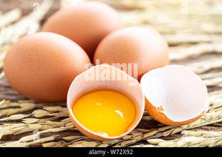 Close up fresh eggs on wooden table for food concept Stock Photo