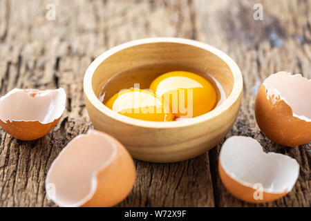 Close up fresh eggs on wooden table for food concept Stock Photo