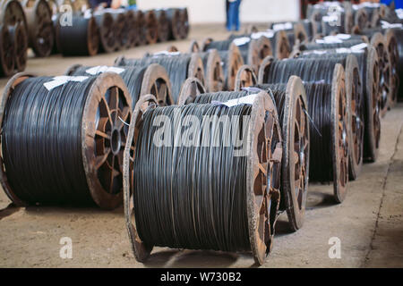 Wire rod, fittings in warehouses. industrial storehouse at the metallurgical plant Stock Photo
