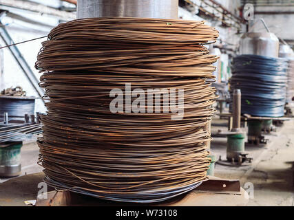 Wire rod, fittings in warehouses. industrial storehouse at the metallurgical plant Stock Photo