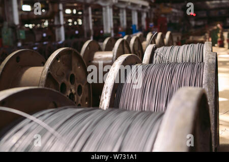 Wire rod, fittings in warehouses. industrial storehouse at the metallurgical plant. Stock Photo