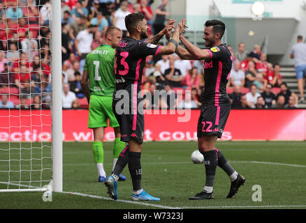 Leeds United's Jack Harrison (right) celebrates scoring his side's third goal of the game with Mateusz Klich during the Sky Bet Championship match at Ashton Gate, Bristol. Stock Photo