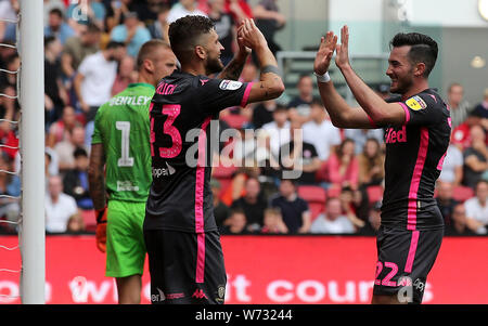 Leeds United's Jack Harrison (right) celebrates scoring his side's third goal of the game with Mateusz Klich during the Sky Bet Championship match at Ashton Gate, Bristol. Stock Photo