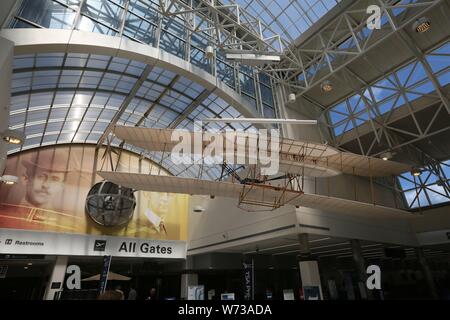 (190804) -- DAYTON (U.S.), Aug. 4, 2019 (Xinhua) -- Photo taken on July 23, 2019 shows the picture of the Wright brothers and a model of the first airplane at the Dayton International Airport in Dayton, Ohio, the United States. Dayton, located in Ohio of the United States, is the hometown of the Wright brothers, inventors of airplane. In about one hundred years following the invention, Dayton is known as the cradle of aviation and became an aviation hub in the states. The Dayton Aviation Heritage National Historical Park and the National Museum of the U.S. Air Force have been established here, Stock Photo