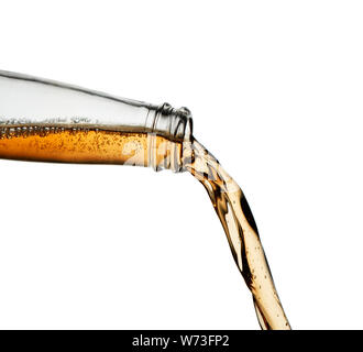Hard cider poured from clear bottle. Stop action closeup Isolated on white Stock Photo