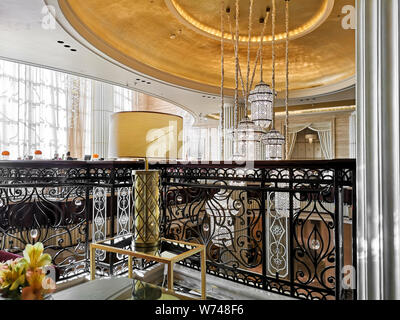 Interior view of a luxurious hotel, modern light chandelier in the hall Stock Photo