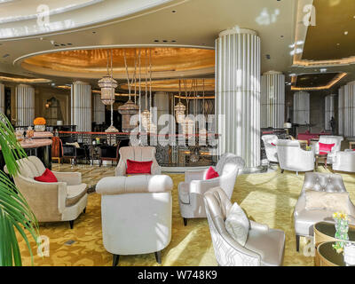 Interior view of a luxurious hotel, modern light chandelier in the hall Stock Photo