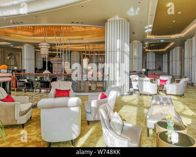 Interior view of a luxurious hotel, modern light chandelier in the hall Stock Photo