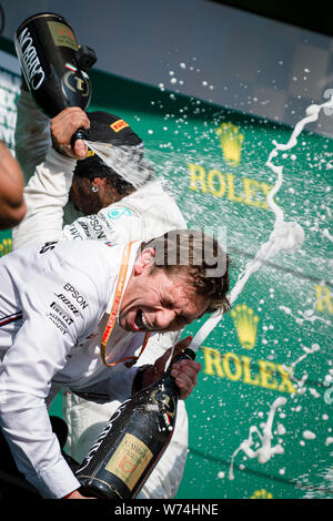 Mercedes AMG Petronas F1 Team’s chief strategist James Vowles and British driver Lewis Hamilton celebrate after winning the Hungarian F1 Grand Prix at Hungaroring Stock Photo