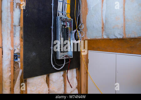 Interior of a new home under construction board connection electric system in cabinet new breakers in control box electrical control panel Stock Photo