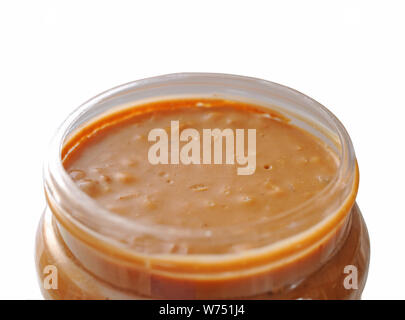 closeup of opened peanut butter jar