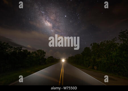 The Milky Way is visible above storm clouds in Everglades National Park. This was photographed on the Scenic Road leading through the park. Stock Photo