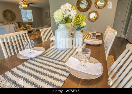 Close up of a beautiful table setting at the dining room of a home Stock Photo