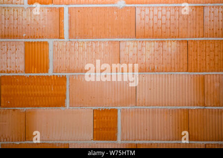 new red brick wall in a newly built house Stock Photo