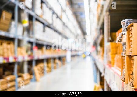 Rows of shelves with goods boxes in modern industry warehouse store at factory warehouse storage, Shelves and racks in distribution storage warehouse Stock Photo