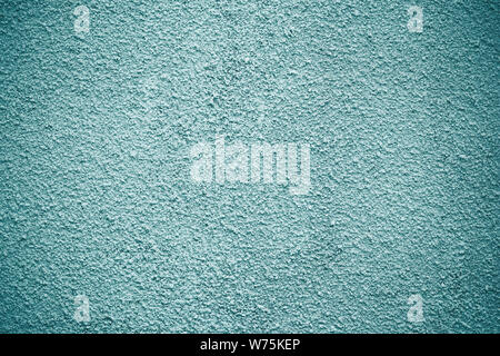 Gray, light green painted concrete wall, cement stucco texture. Blue modern grunge background. Rough paper surface. Decorative stone pattern. Stock Photo