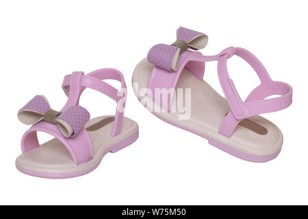 Pink sandals isolated. Close up of cute pink sandals with a bow for