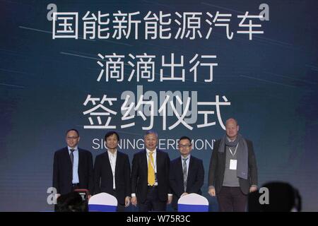 Jiang Dalong, center, chairman of National Electric Vehicle Sweden (NEVS), and guests attend the signing ceremony between NEVS and Didi Chuxing on the Stock Photo