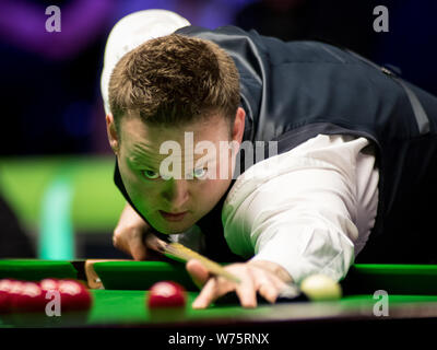Shaun Murphy of England plays a shot to Ryan Day of Wales in their semi-final match during the 2017 Betway UK Championship snooker tournament in York, Stock Photo