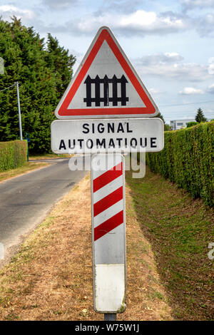 a french road sign railway crossing ahead (automatic signal) Stock Photo