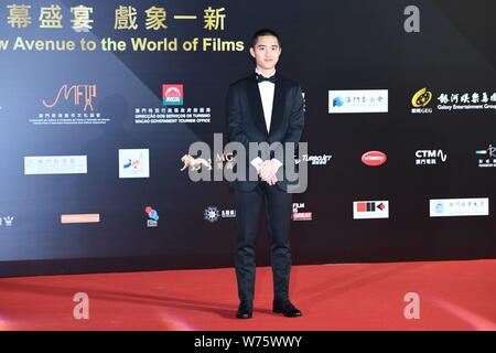 South Korean singer and actor Do Kyung-soo, better known by his stage name D.O., of South Korean boy group EXO, poses as he arrives on the red carpet Stock Photo