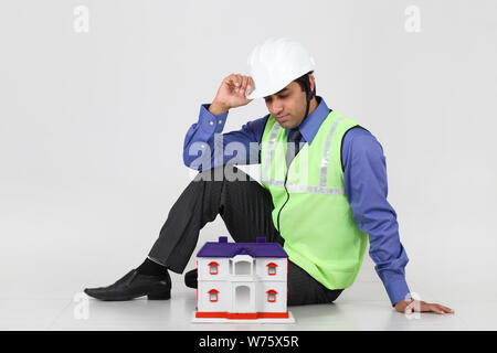 Architect showing model of dream home Stock Photo