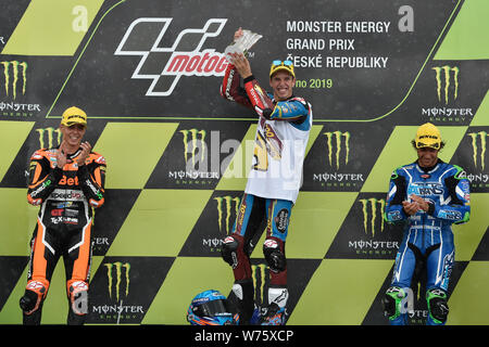 Brno, Czech Republic. 04th Aug, 2019. Road racers L-R Fabio Di Giannantonio (Italy), Alex Marquez (Spain) and Enea Bastianini (Italy) are seen on the podium during the Czech Republic motorcycle Grand Prix 2019 after Moto2 category race, in Brno Circuit, Czech Republic, on August 4, 2019. Credit: Vaclav Salek/CTK Photo/Alamy Live News Stock Photo