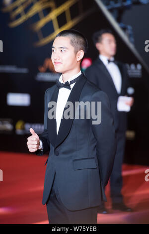 South Korean singer and actor Do Kyung-soo, better known by his stage name D.O., of South Korean boy group EXO, poses as he arrives on the red carpet Stock Photo