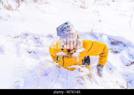 A tourist has fun in snow-covered Hulunbuir city in north China's Inner Mongolia Autonomous Region, 25 December 2017. Stock Photo