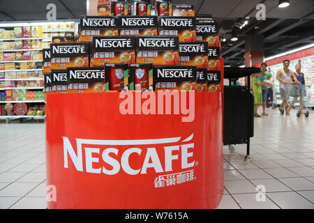--FILE--Cartons of Nescafe instant coffee of Nestle are for sale at a supermarket in Xuchang city, central China's Henan province, 29 June 2014.     S Stock Photo