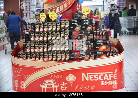 --FILE--Cartons of Nescafe instant coffee of Nestle are for sale at a supermarket in Xuchang city, central China's Henan province, 25 January 2015. Stock Photo