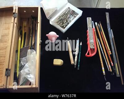 The tools used by 76-year-old Chinese elderly man Hu Zhanlin to carve eggshells into decorating eggs in Jingshui village, Huiji district, Zhengzhou ci Stock Photo