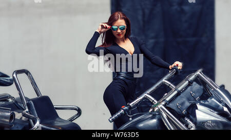 woman biker standing near her classy trike. the concept of lifestyle Stock Photo