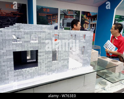 --FILE--A model house built with 3D-printed bricks is on display during an exhibition in Shanghai, China, 16 September 2017.   China has moved to bols Stock Photo