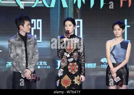 Chinese actress Liu Yifei, center, and Chinese actor Feng Shaofeng, left, attend a press conference for their movie 'Hanson and the Beast' in Beijing, Stock Photo