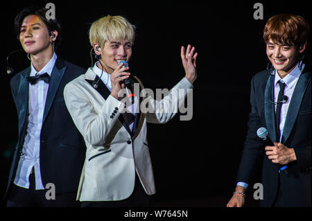 South Korean singer-songwriter Kim Jong-hyun, center, better known as Jonghyun, and other members of South Korean boy group SHINee interact with fans Stock Photo