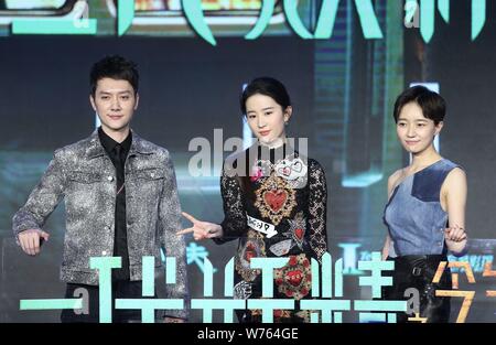 Chinese actress Liu Yifei, center, and Chinese actor Feng Shaofeng, left, attend a press conference for their movie 'Hanson and the Beast' in Beijing, Stock Photo