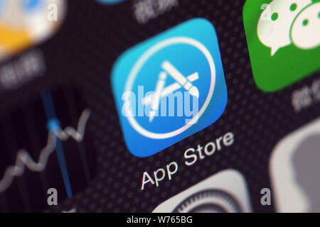 --FILE--A Chinese mobile phone user shows the icons of App Store app, left, and messaging app Weixin, or WeChat, of Tencent on his iPhone smartphone i Stock Photo