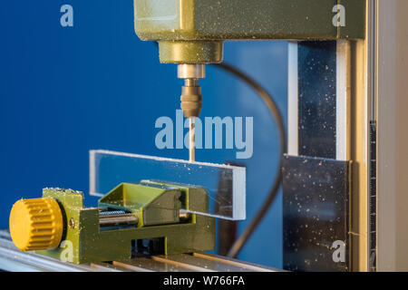 CNC  milling machine processes glass Stock Photo