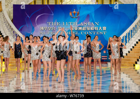 Contestants display creations during the 11th Asian Supermodel Contest at Imperial Palace in Saipan, Northern Mariana Islands, 16 December 2017.   A t Stock Photo