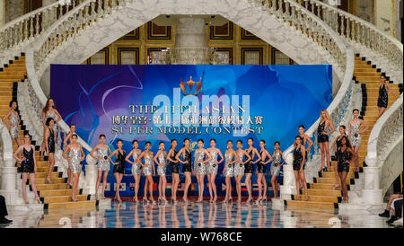 Contestants display creations during the 11th Asian Supermodel Contest at Imperial Palace in Saipan, Northern Mariana Islands, 16 December 2017.   A t Stock Photo