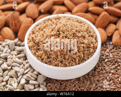 Homemade LSA mix in plate - Linseed or flax seeds, Sunflower seeds and Almonds. Traditional Australian blend of ground, source of dietary fiber, protein, omega fatty acids. Copy space for text. Stock Photo