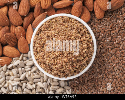 Homemade LSA mix in plate - Linseed or flax seeds, Sunflower seeds and Almonds. Traditional Australian blend of ground, source of dietary fiber, protein, omega fatty acids.Copy space for text.Top view Stock Photo