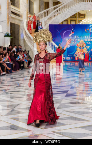 A contestant displays a creation during the 11th Asian Supermodel