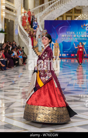 A contestant displays a creation during the 11th Asian Supermodel