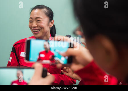 Japanese cleaning worker Haruko Niitsu is interviewed in a toilet at Shenzhen North Railway Station in Shenzhen city, south China's Guangdong province Stock Photo